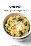 A quick and easy dinner recipe that delivers! This one pan Italian sausage orzo is made with with red bell peppers, onions, garlic, orzo, chicken broth, cream, parmesan, and spinach. It's perfect for busy weeknights— minimal effort and minimal clean up!