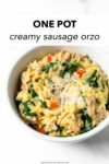 A quick and easy dinner recipe that delivers! This one pan Italian sausage orzo is made with with red bell peppers, onions, garlic, orzo, chicken broth, cream, parmesan, and spinach. It's perfect for busy weeknights— minimal effort and minimal clean up!