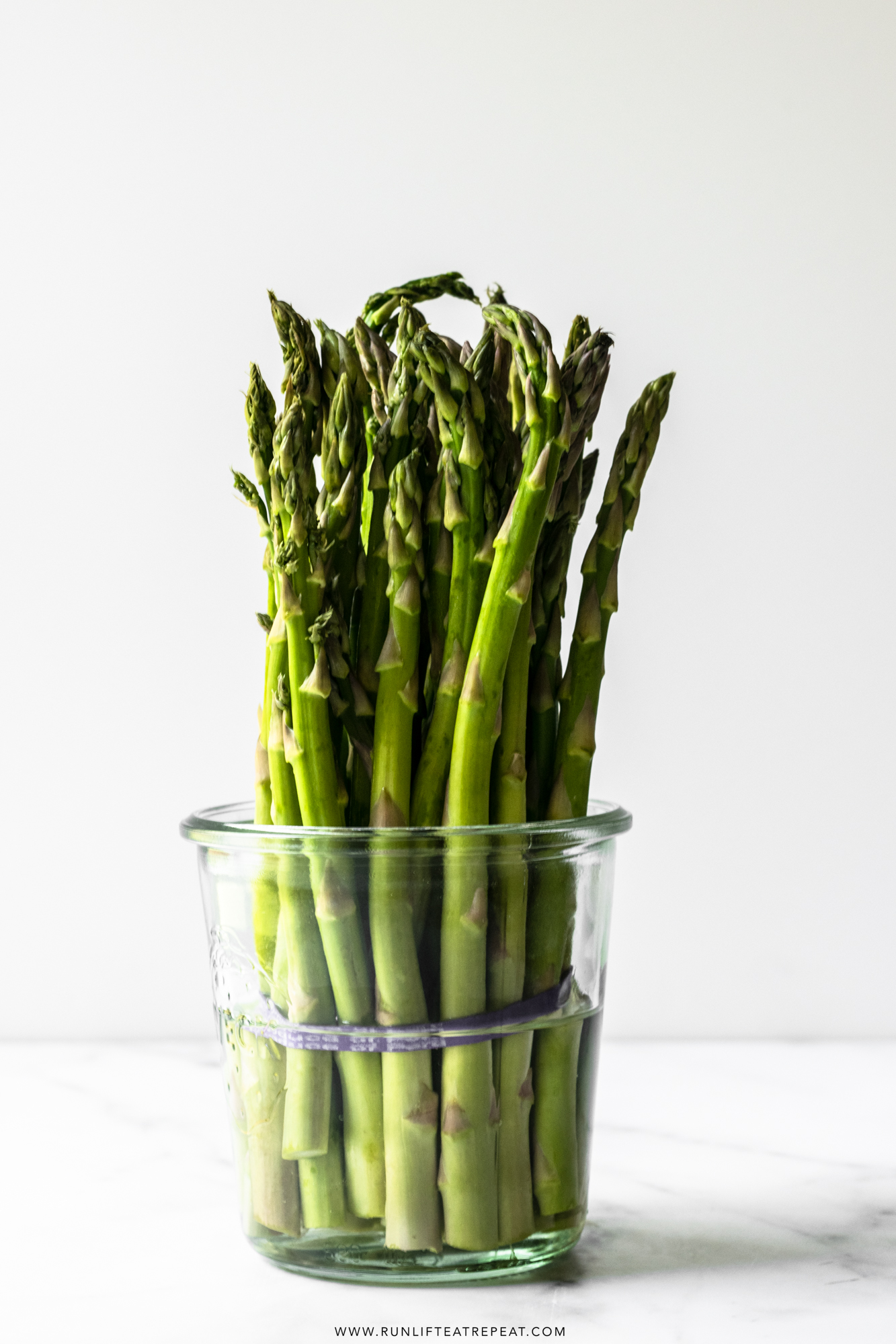 This roasted asparagus recipe is seasoned with olive oil, fresh garlic, salt, pepper, and finished with freshly squeezed lemon juice. It's a simple, flavor packed side dish that everyone will love and it's on the table in just 20 minutes!