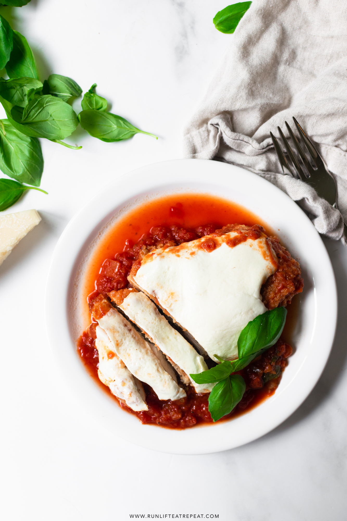 Learn how to make chicken parmesan at home in just 35 minutes! It's made with basic ingredients and smothered in flavorful marinara sauce, topped with fresh mozzarella cheese. It's the easiest chicken parmesan recipe that you'll ever make!