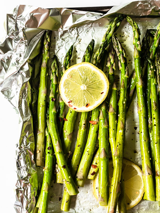 This roasted asparagus recipe is seasoned with olive oil, fresh garlic, salt, pepper, and finished with freshly squeezed lemon juice. It's a simple, flavor packed side dish that everyone will love!