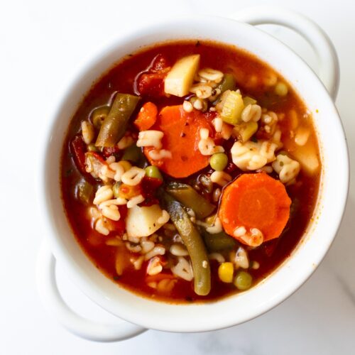 This homemade alphabet vegetable soup recipe is easy, satisfying, hearty, and flavorful. Not only is this soup made in one pot, it keeps perfectly for lunches all week. Use your favorite vegetables and small shaped pasta, like alphabet pasta.