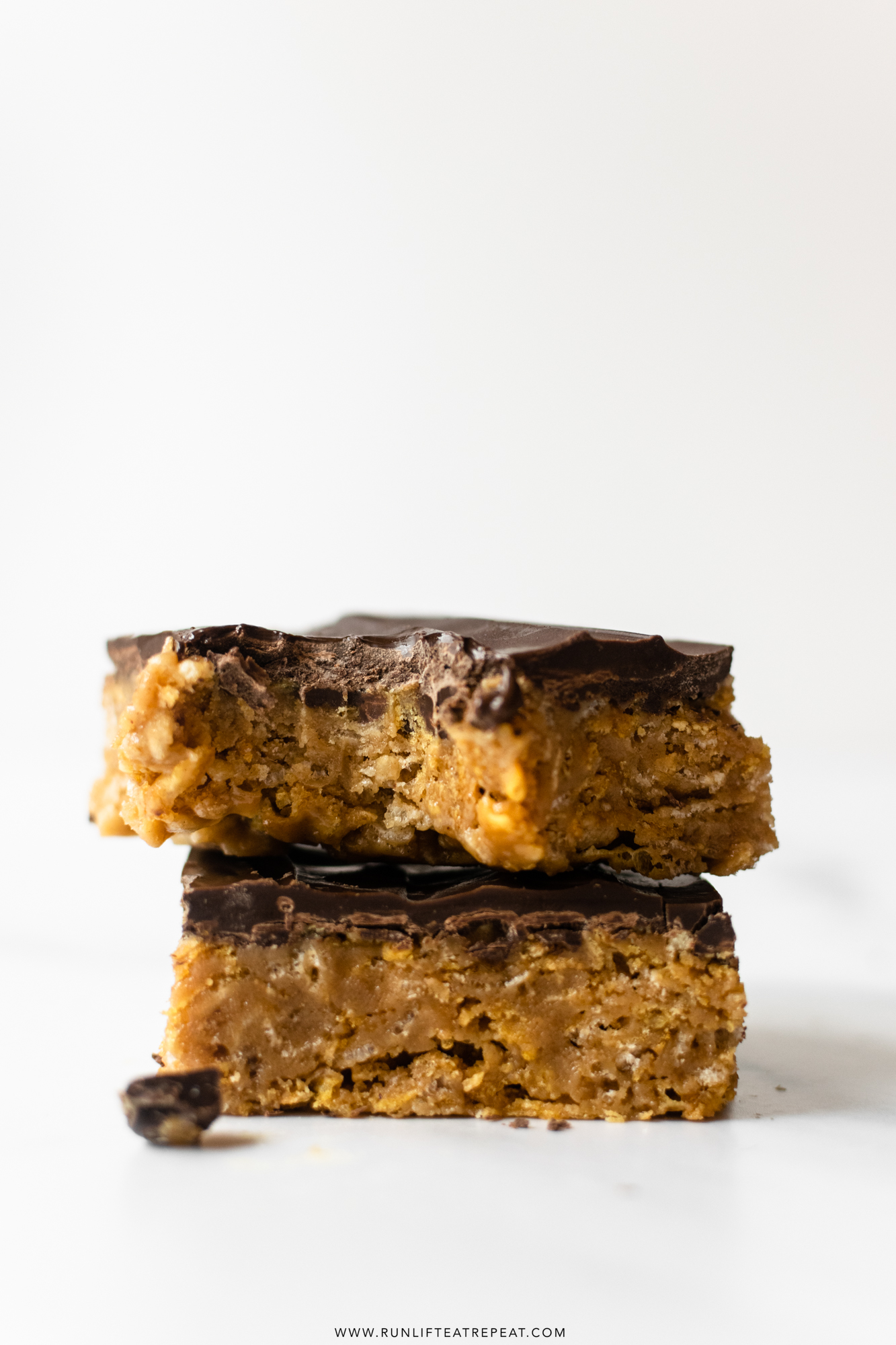 Made from just 8 ingredients, these no-bake chocolate peanut butter crunch bars are chewy, crispy, and irresistible. These are a delicious treat anytime of the year. No oven required! Warning: these bars are incredibly addicting. 