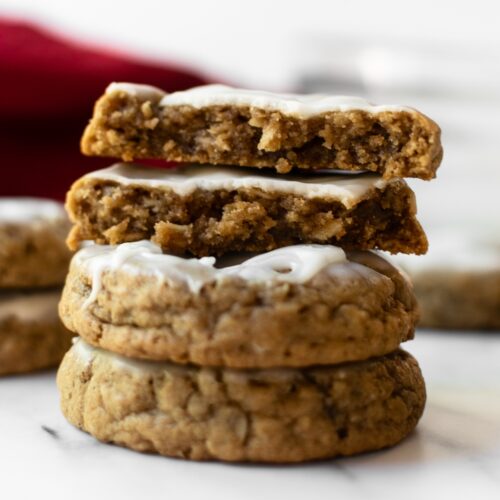 These classic iced oatmeal cookies are the old-fashioned style that you know and love from your childhood. With soft centers, crisp chewy edges, and topped with vanilla icing, these will be favorite for friends and family!