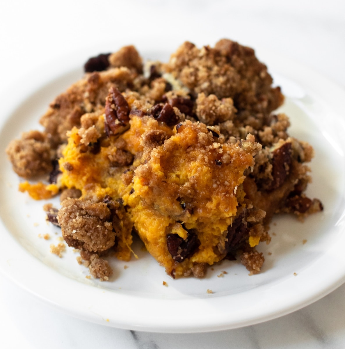 This homemade sweet potato casserole will be a star on your Thanksgiving table— one bite and you'll know why! It's full of flavor, comes together quick and topped with a pecan crumble topping for added crunch.