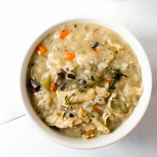 This slow cooker creamy chicken and rice soup is incredibly simple to make. Made with carrots, celery, onions, mushrooms, chicken, rice, variety of spices, and finished off with cream. Pair this with grilled cheese or crusty bread for dinner on a cold evening!