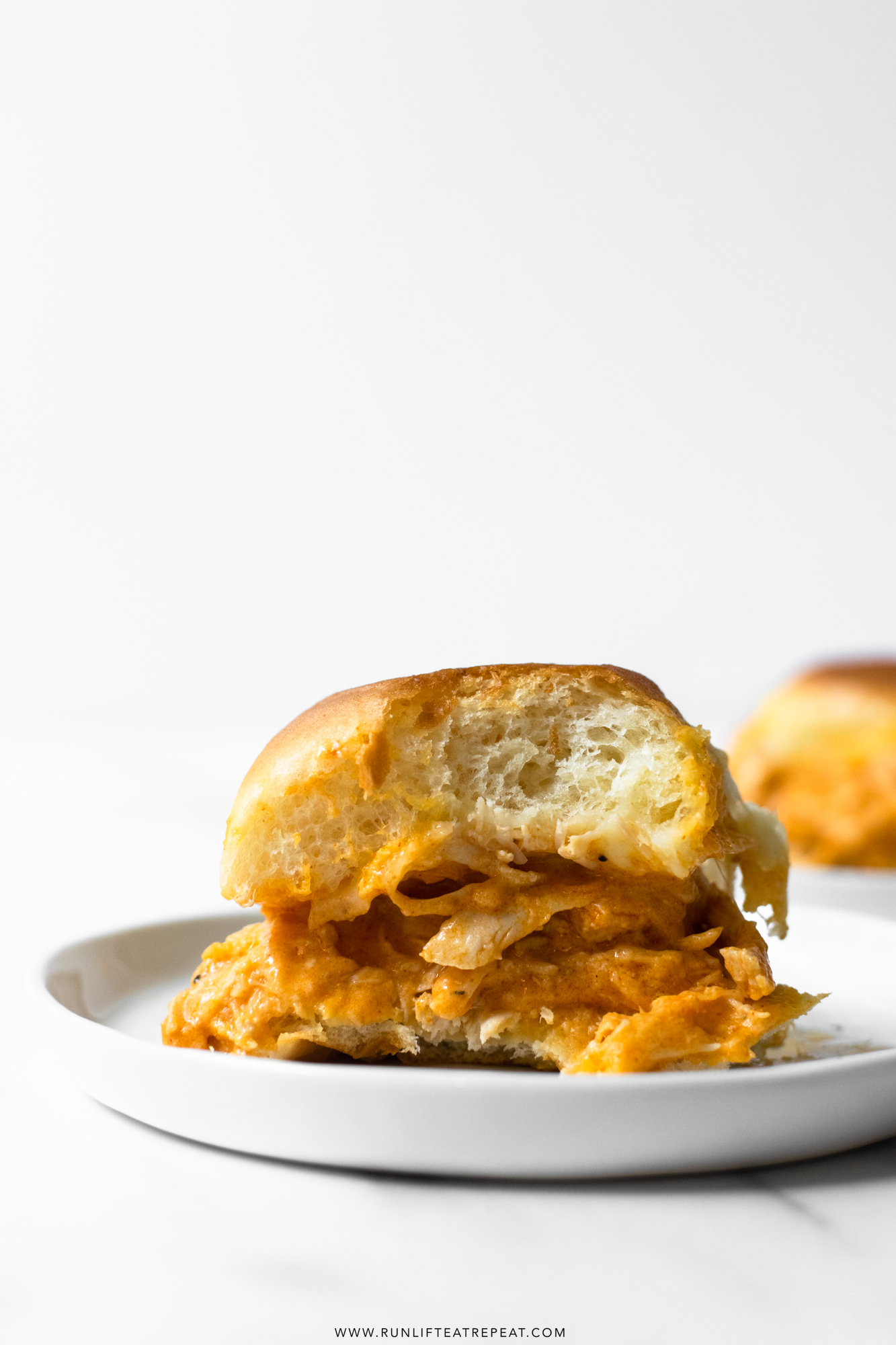 These slow cooker buffalo chicken sliders are an instant crowd-pleaser. Toss the ingredients together in a slow cooker and let it do 99% of the work for you! Your guests will be coming back for more— perfect for game days!