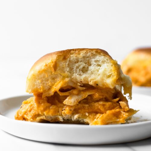 These slow cooker buffalo chicken sliders are an instant crowd-pleaser. Toss the ingredients together in a slow cooker and let it do 99% of the work for you! Your guests will be coming back for more— perfect for game days!