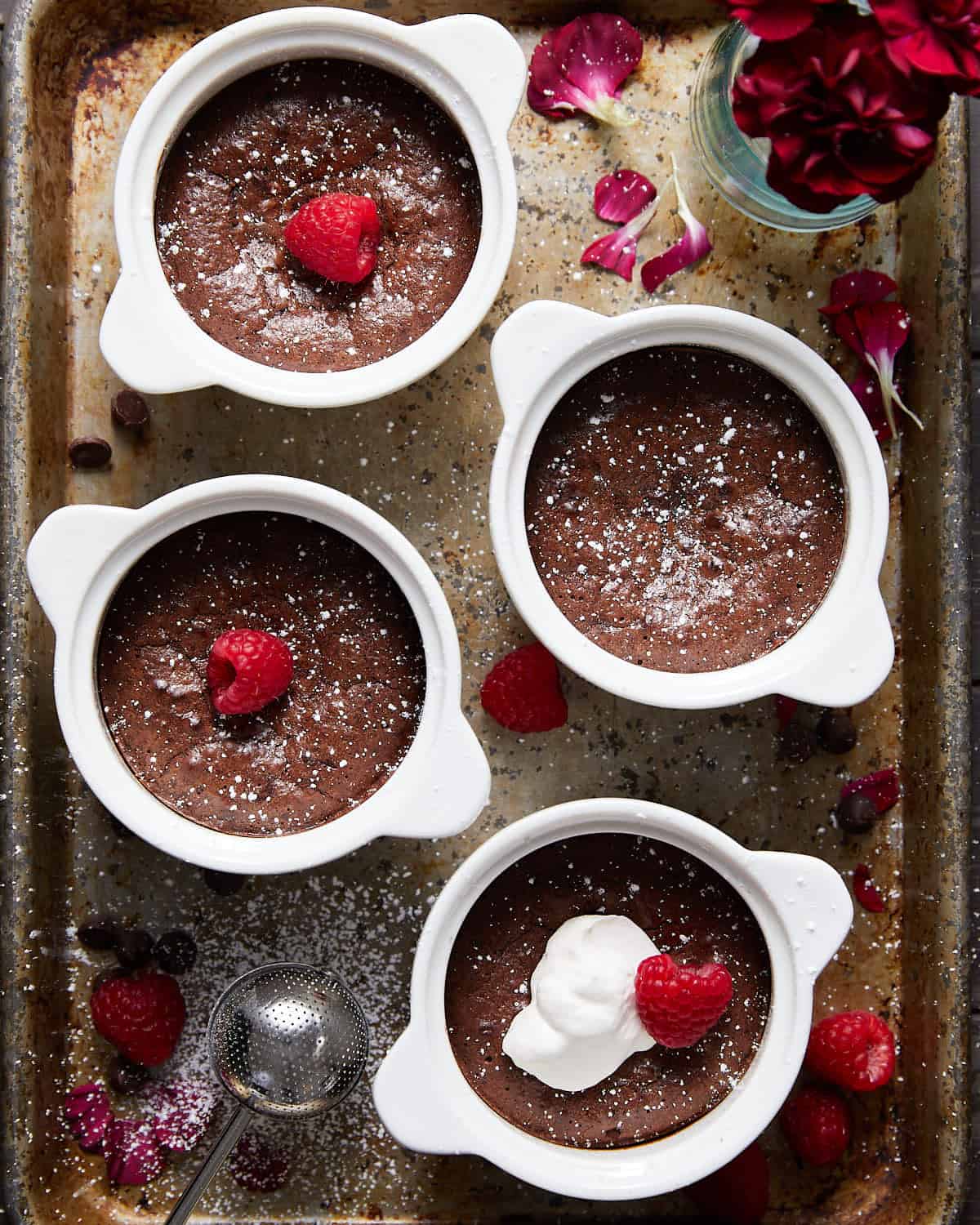 mini flourless chocolate cakes on a baking sheet