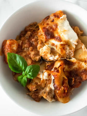 One skillet is all you need to make this insanely flavorful lasagna recipe. The process is extremely easy: add the ground beef with a mixture of Italian spices and brown in a skillet. Then, toss in the remaining ingredients and finish with ricotta and shredded mozzarella cheese. This is a quick, family favorite 30-minute dinner recipe that you'll want to make all year long!
