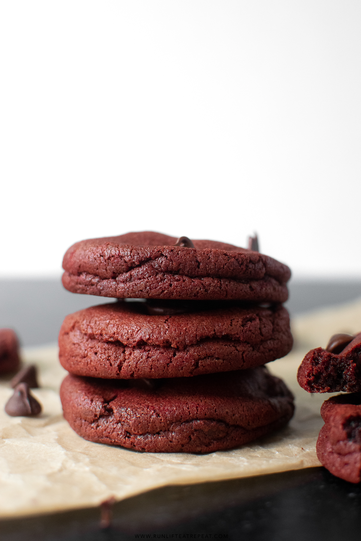 red velvet chocolate chip cookies stacked