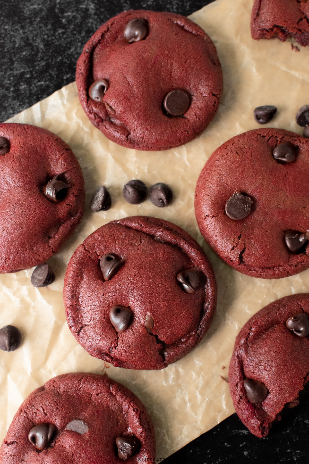 red velvet chocolate chip cookies on baking sheet
