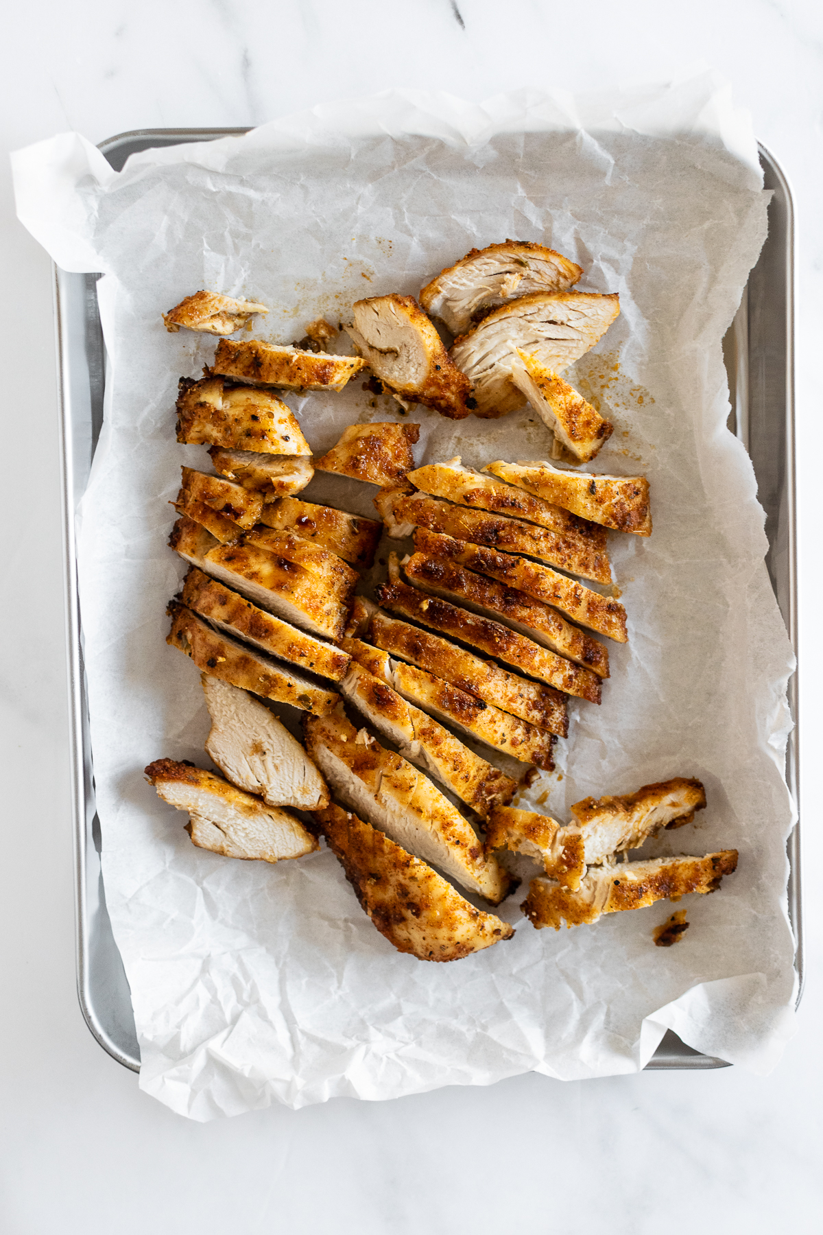 sliced air fryer chicken on tray