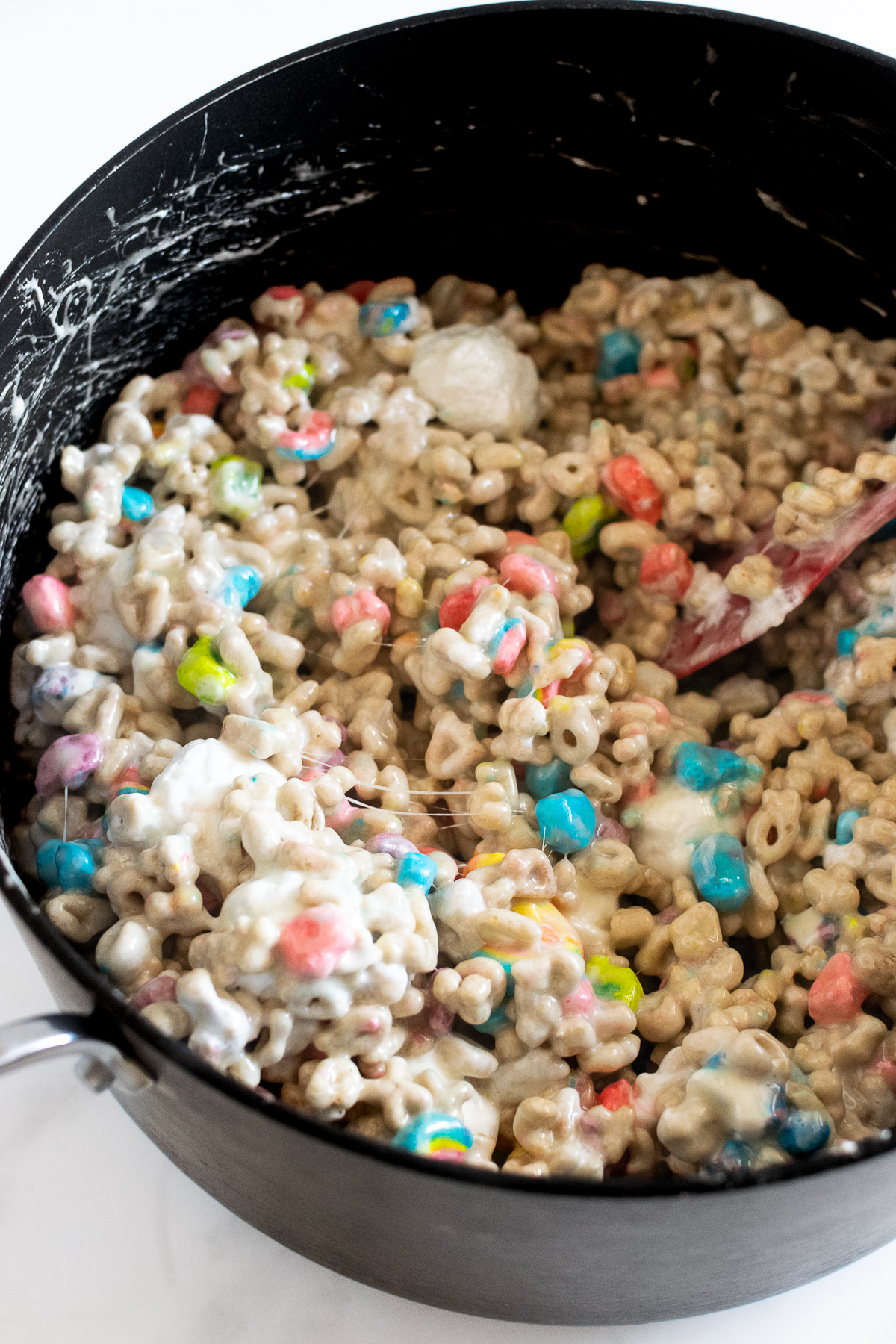 lucky charms cereal with marshmallow mixture in large pot