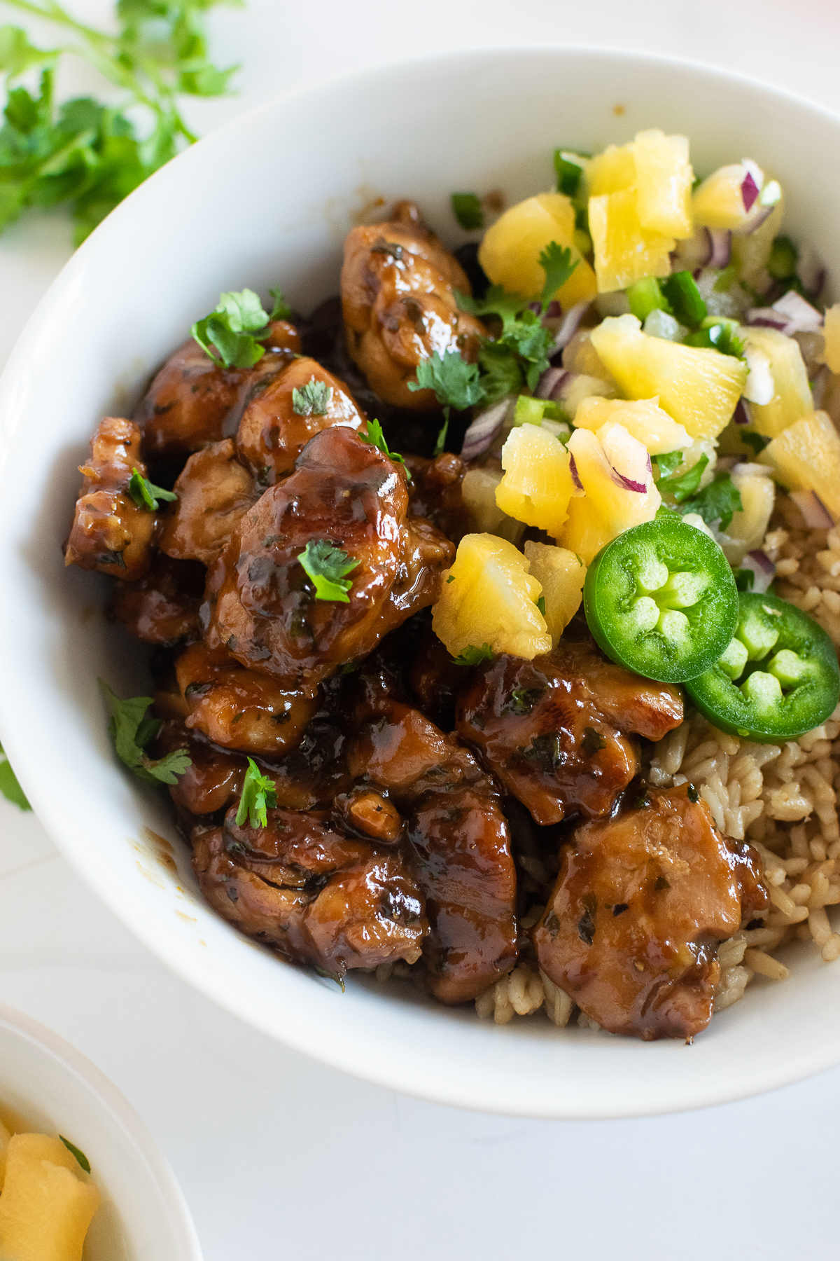 Juicy, tender and sweet– this cilantro orange chicken is minimum effort with maximum flavor making it an ideal dinner recipe for busy weeknights. The marinade adds incredible flavor to the chicken and creates the best sauce. Serve it alongside rice and beans with a homemade pineapple jalapeño salsa.