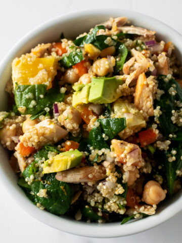 This citrus quinoa salad is light and hearty– filled with quinoa, spinach, chicken, pepper, onion, fresh cilantro, oranges, and creamy avocado. Bursting with flavor from the refreshing citrus vinaigrette, this quinoa salad is a warmer weather staple!