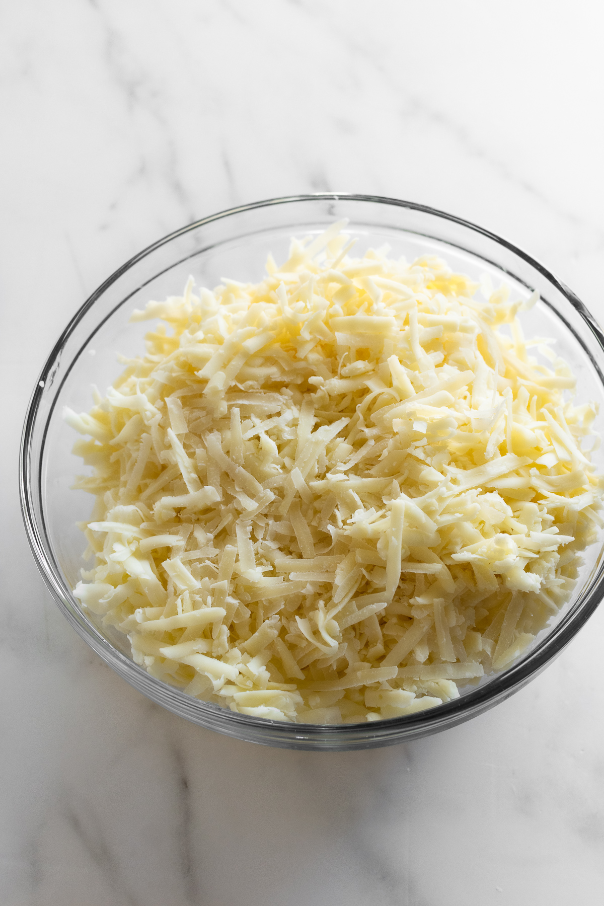 shredded cheese in bowl for macaroni and cheese