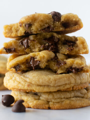 This chewy chocolate chip cookies recipe is a family favorite recipe and produces BIG and thick cookies. Using melted butter, more brown sugar than white sugar, cornstarch and 2 extra egg yolks guarantees the chewiest cookie texture. And the best part: no mixer required!