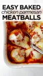 baked chicken parmesan meatballs in a white baking dish with spoon.