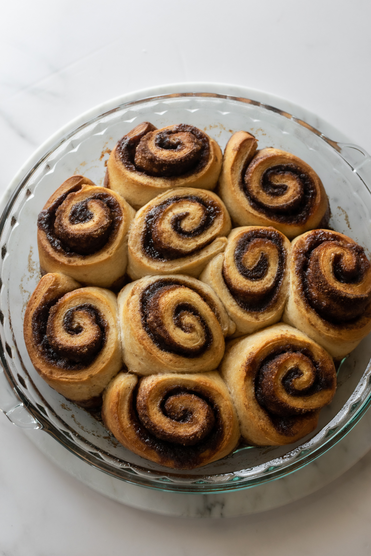 baked cinnamon rolls in a pie dish using crescent rolls.