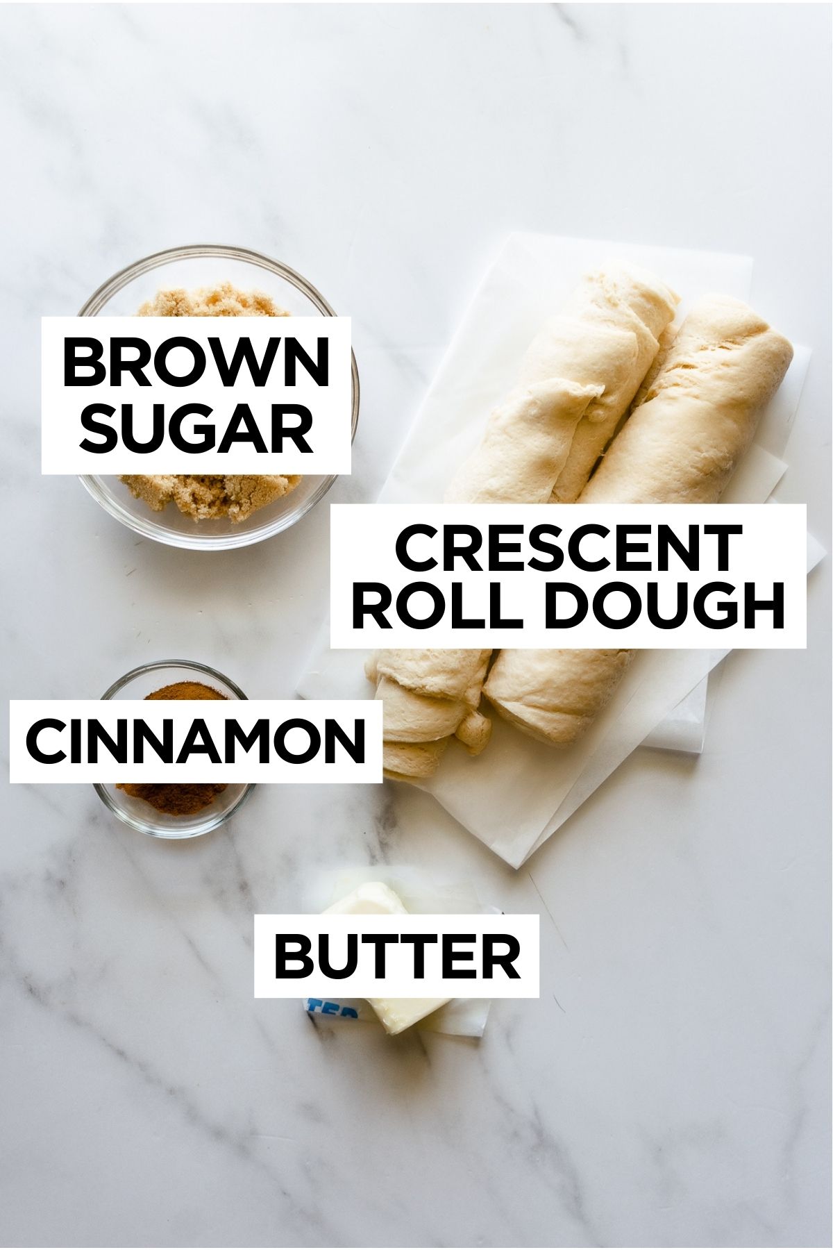 crescent roll cinnamon rolls ingredients such as brown sugar, crescent roll dough, cinnamon and butter.