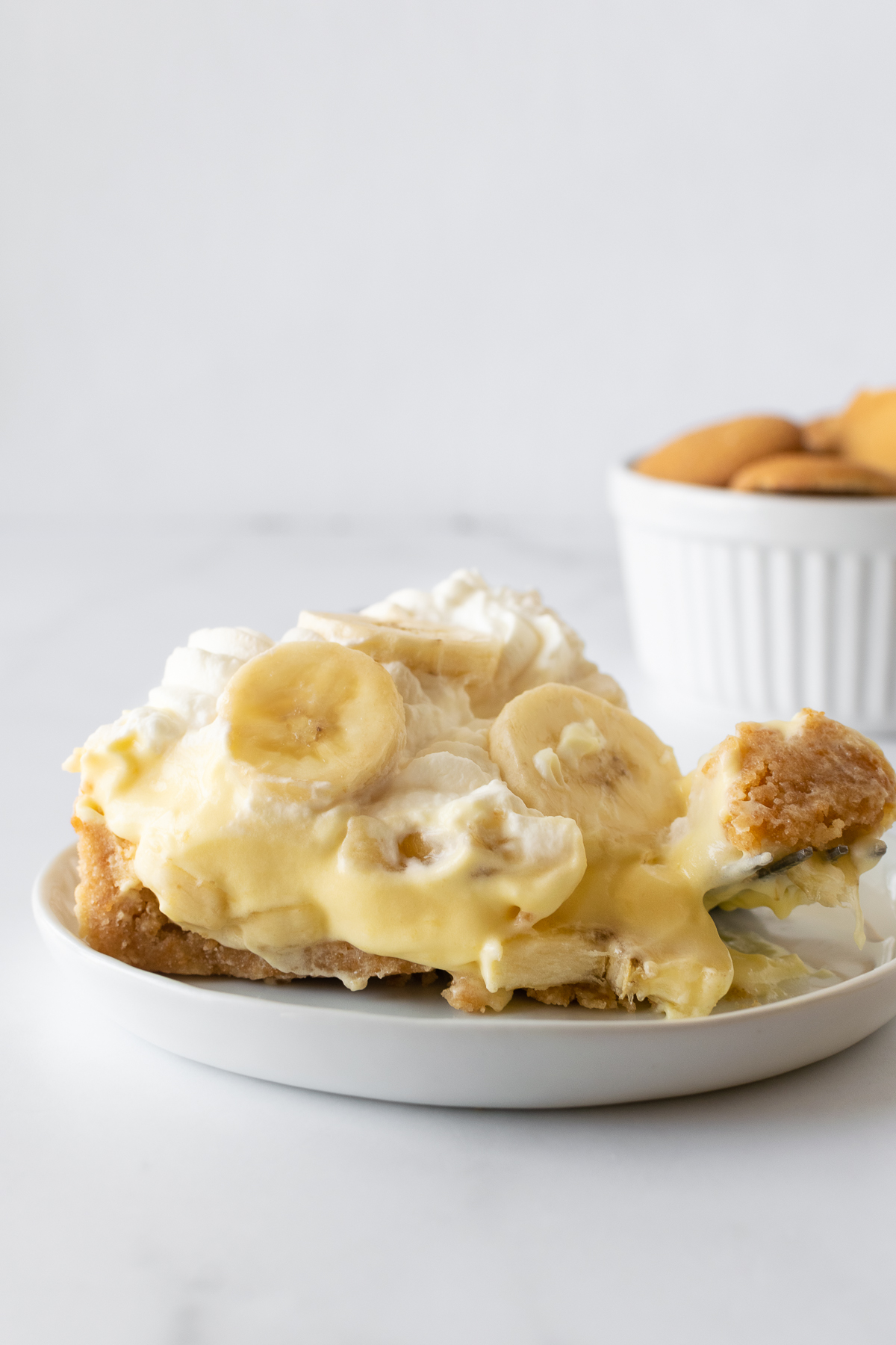 Get ready to fall in love with this no-bake banana pudding pie recipe. It starts with a buttery Nilla Wafer cookie crust, a layer of fresh banana slices and creamy vanilla pudding, and finished with homemade whipped cream. After the first bite you'll immediately know why it's loved by many!
