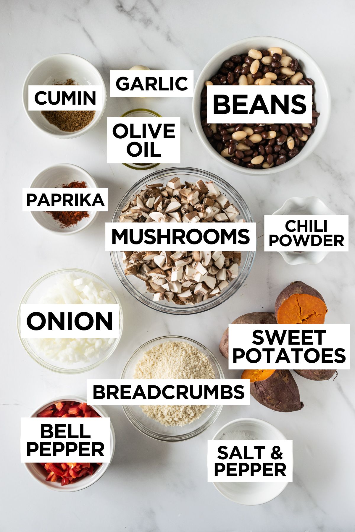 ingredients for veggie burgers in bowls such as beans, mushrooms, onion, sweet potato, etc.