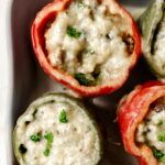 sausage stuffed peppers with melted cheese.