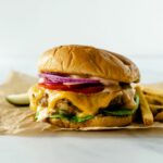 cheddar jalapeno turkey burgers topped with lettuce, melted cheese, tomato, jalapenos and onion.