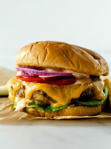 cheddar jalapeno turkey burgers topped with lettuce, melted cheese, tomato, jalapenos and onion.