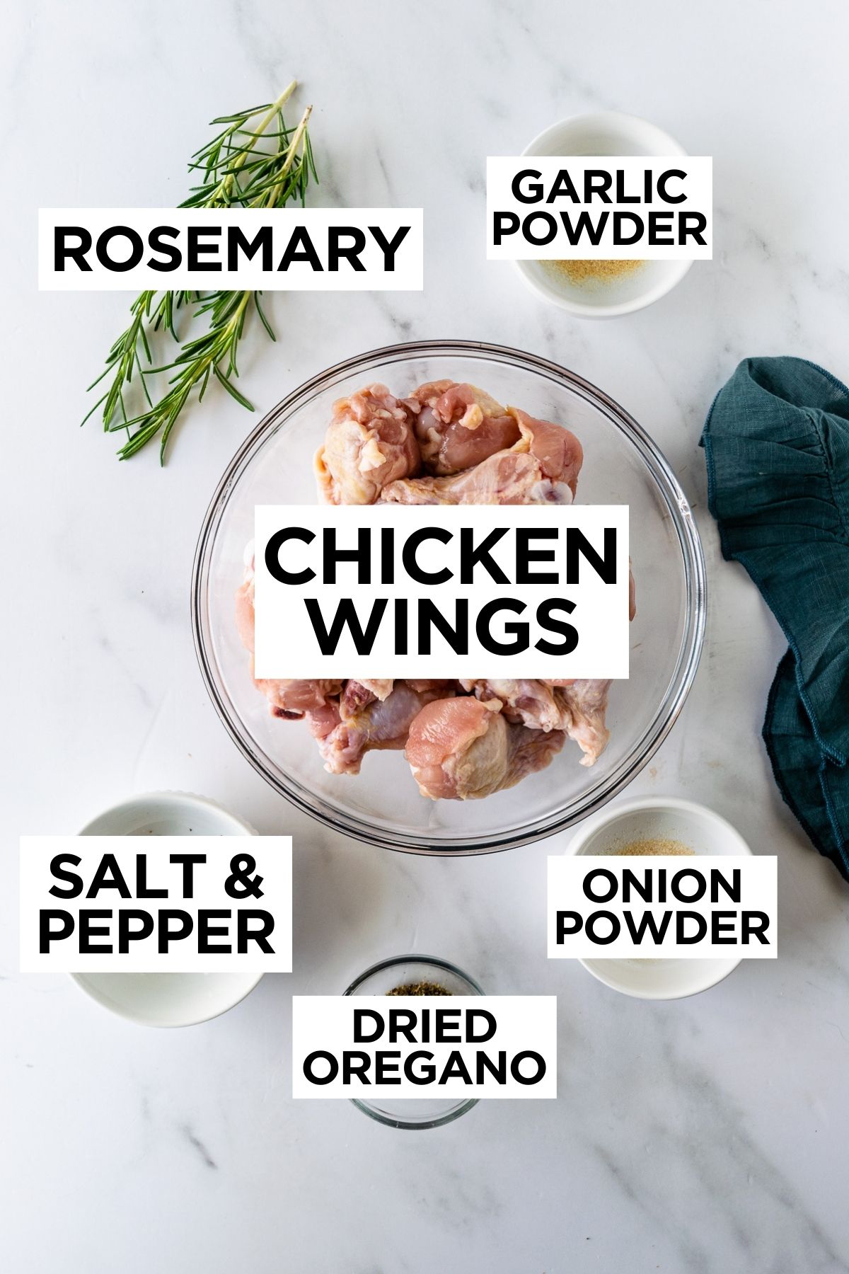 ingredients for grilled chicken wings such as wings, fresh rosemary and spices.