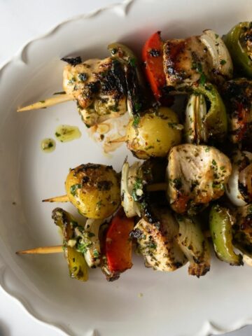 Upgrade your weeknight dinners with these delicious chimichurri chicken kabobs. Marinate cubed chicken breast in a homemade chimichurri sauce, skewered with vegetables, grill (or bake in the oven), and finish with more chimichurri sauce. Simple to make, incredibly flavorful, and quick to disappear– this chimichurri chicken recipe is sure to become a family favorite!