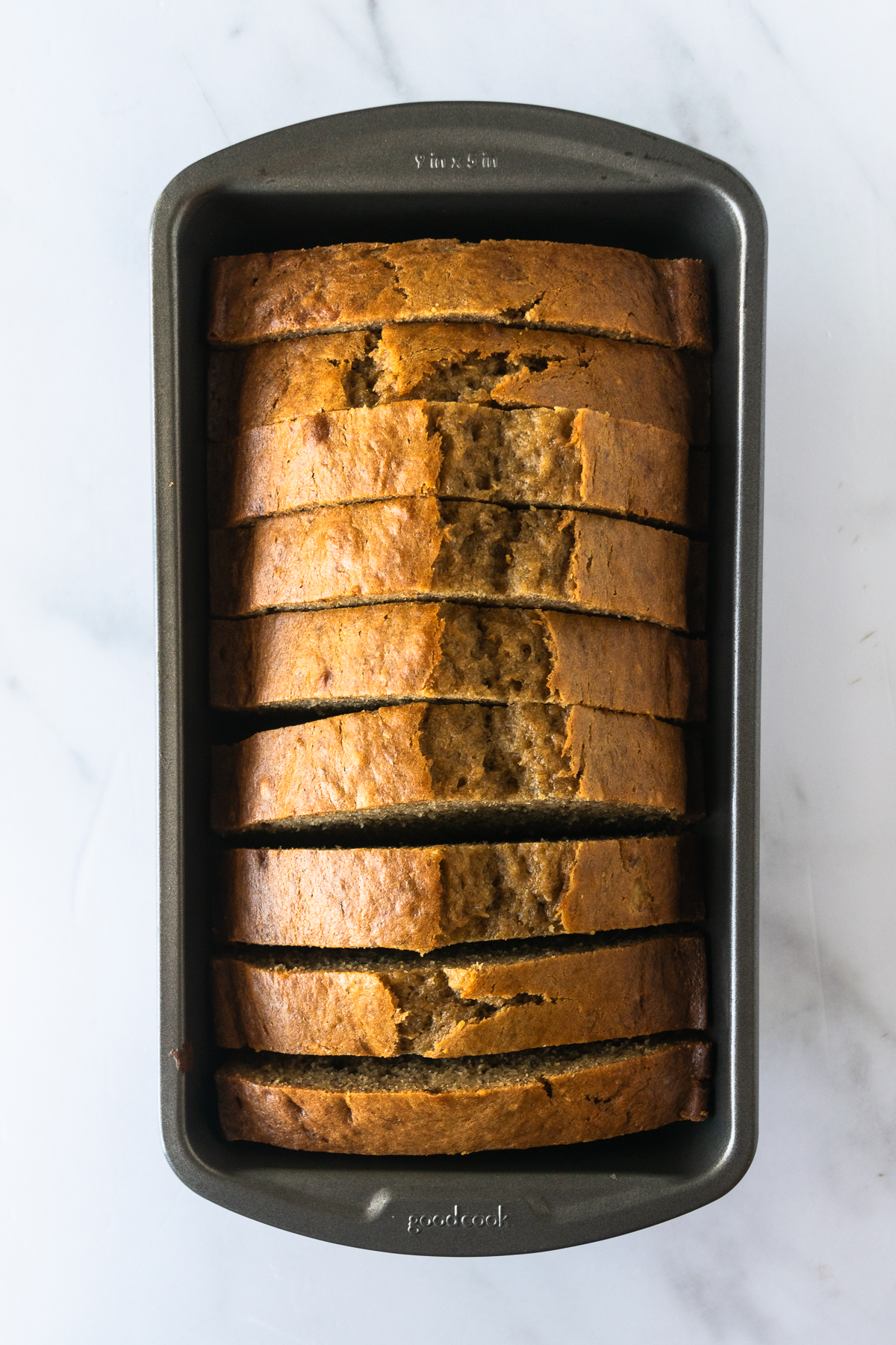 banana bread sliced in a loaf pan.