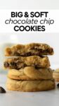 stacked soft chocolate chip cookies on a white table.