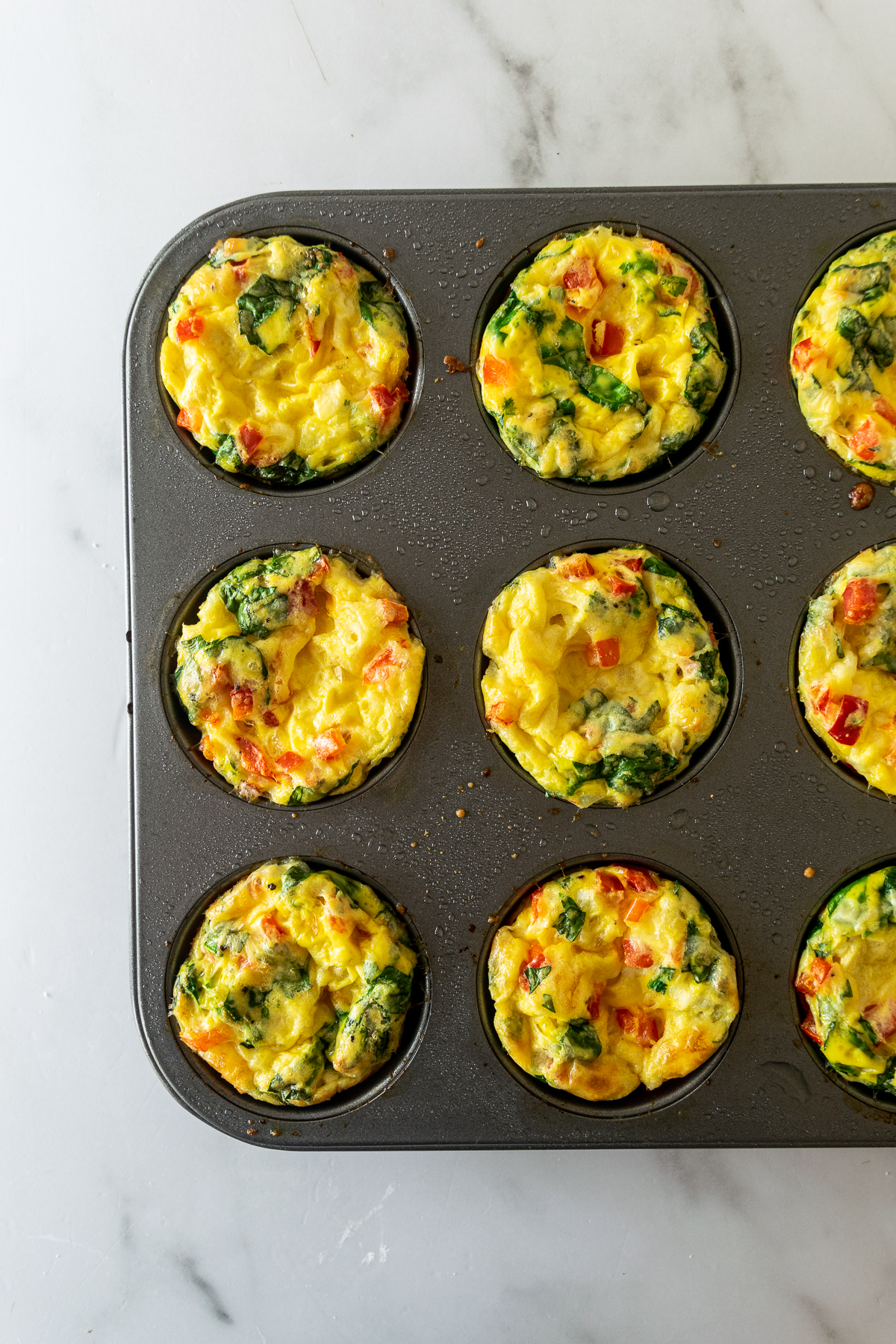 baked egg muffins in a muffin tin.