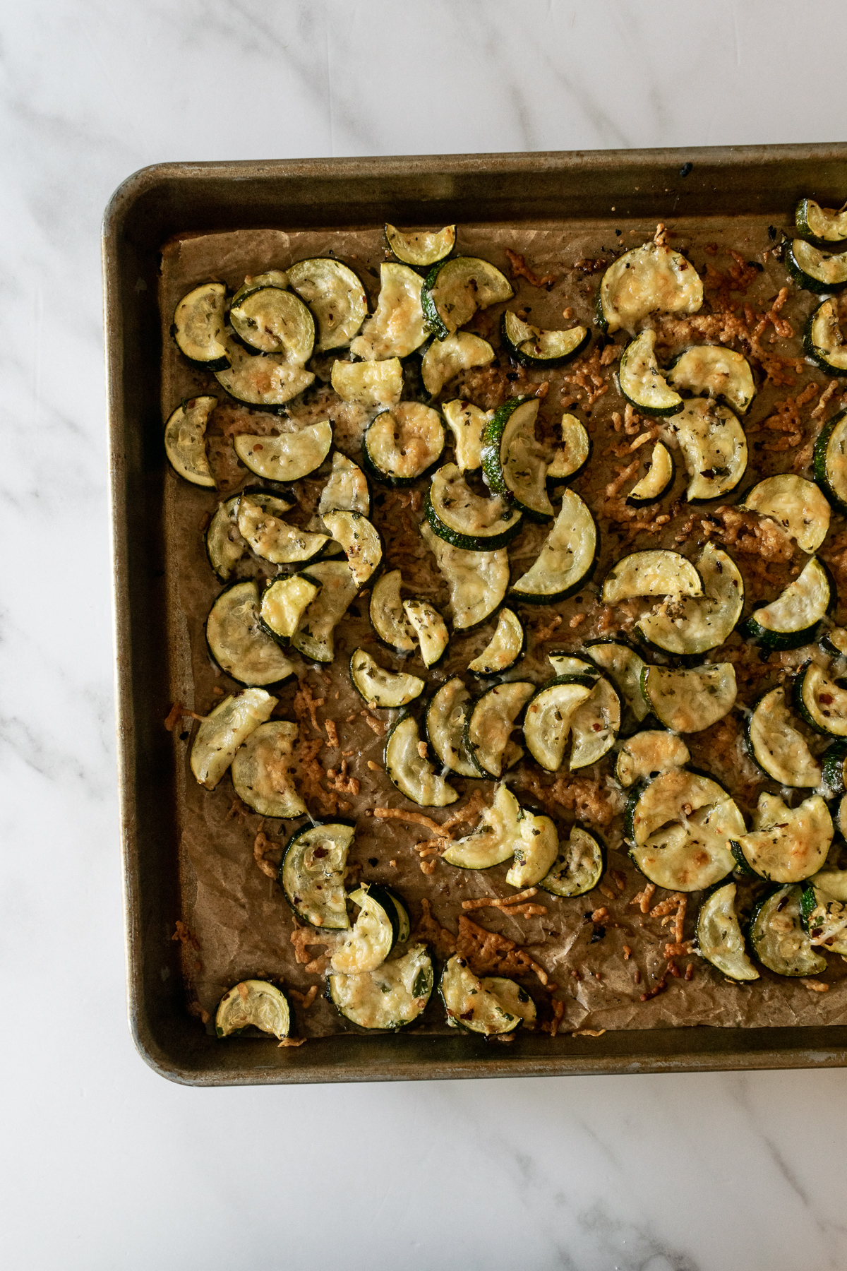 oven roasted zucchini on a baking sheet.