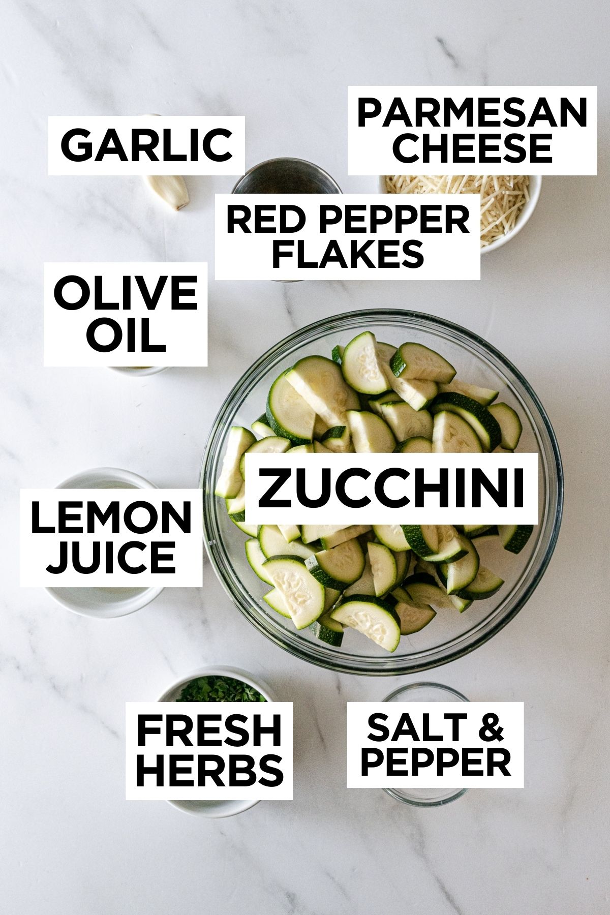 oven roasted zucchini ingredients in bowls on a white table.