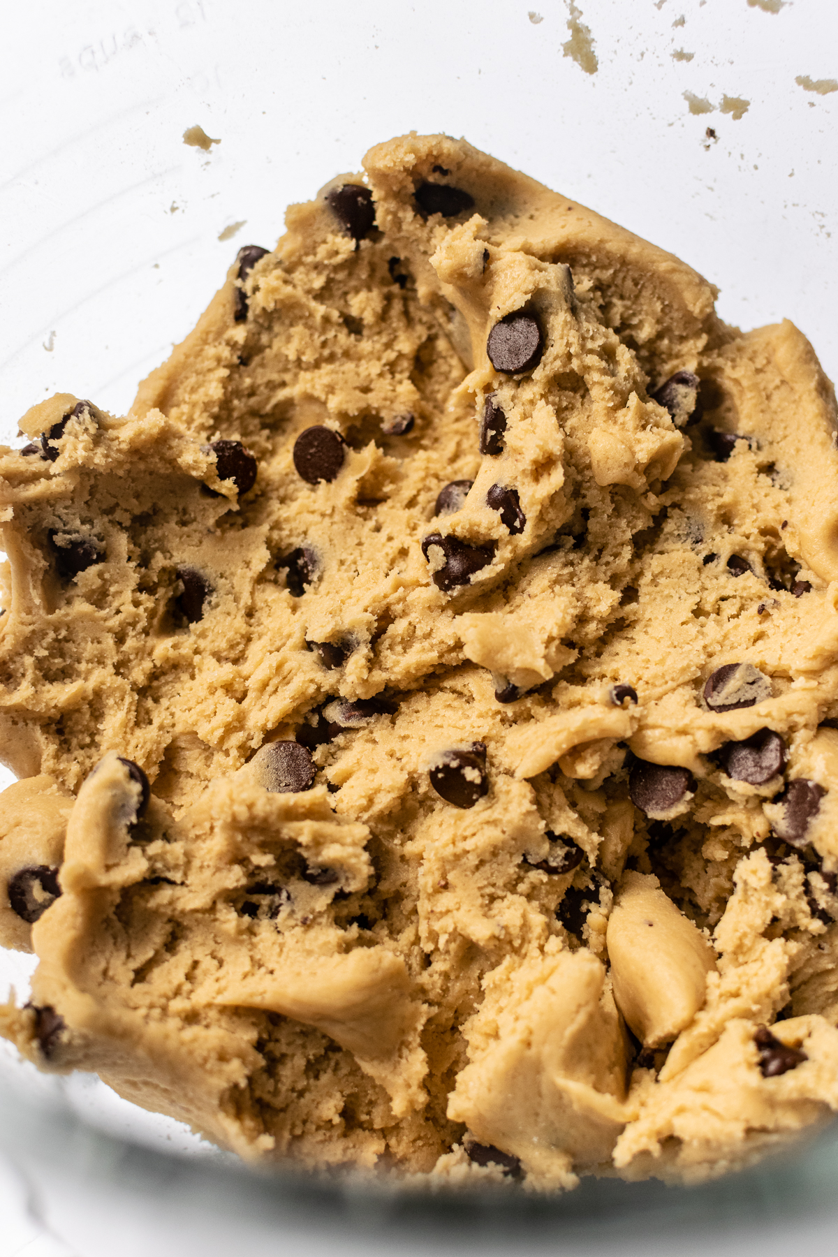 cookie dough for soft chocolate chip cookies in a bowl.