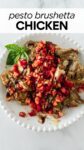 bruschetta chicken on a white plate with diced tomatoes and balsamic glaze on top.