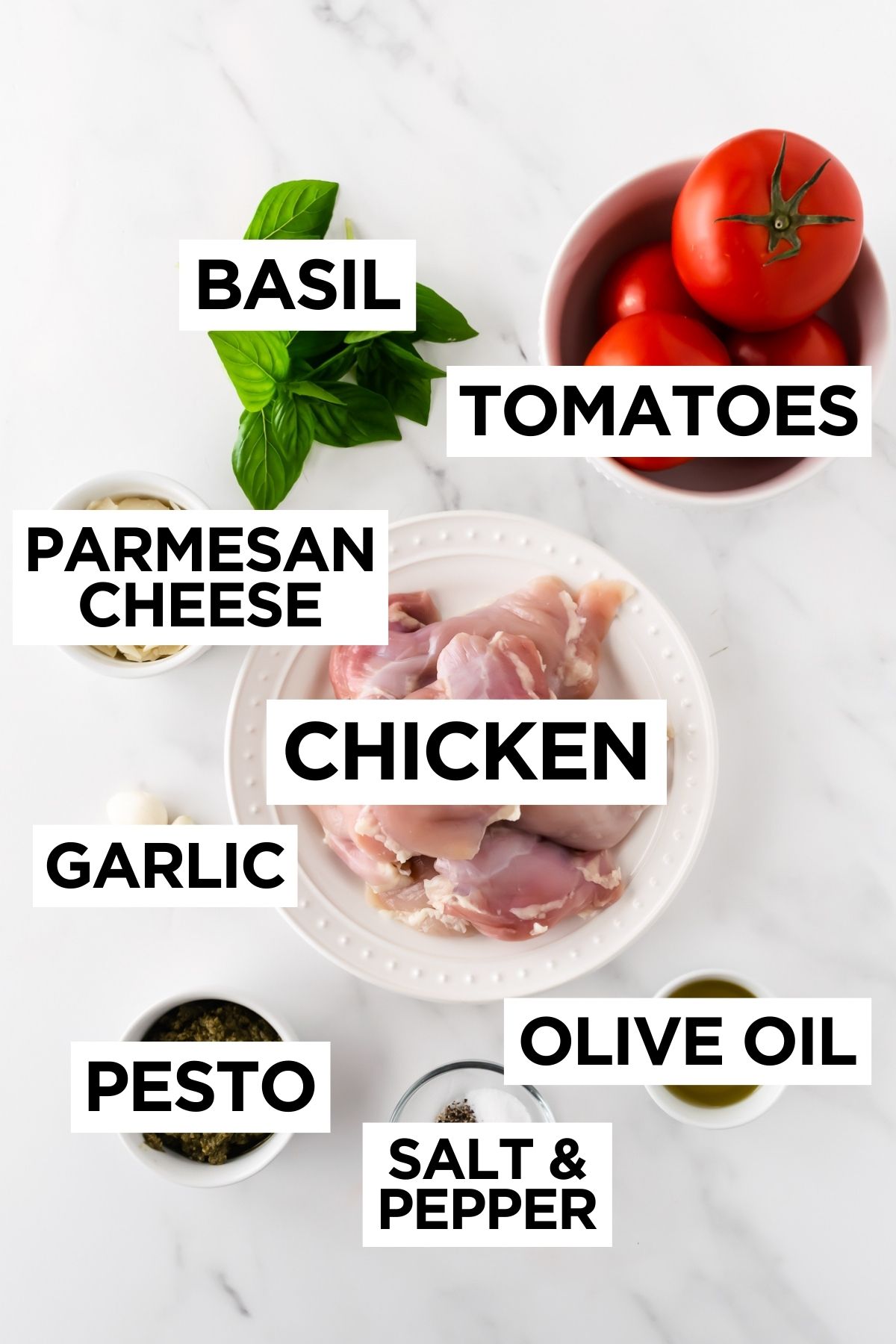 ingredients for pesto bruschetta chicken in bowls on a white table.