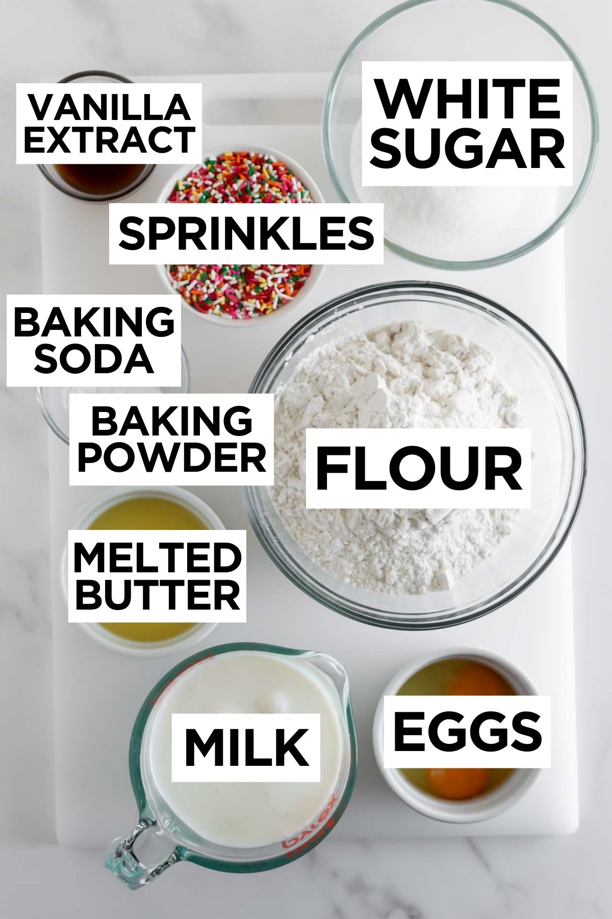 ingredients for birthday cake pancakes in bowls with overlay text.