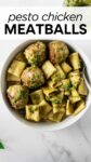 pesto chicken meatballs with pasta in a white bowl with overlay text for Pinterest.