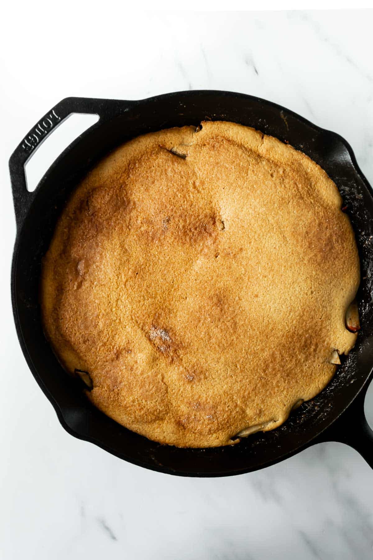 baked apple cinnamon pancake in a skillet.