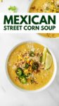 corn chowder in a white bowl with overlay text "Mexican street corn soup".