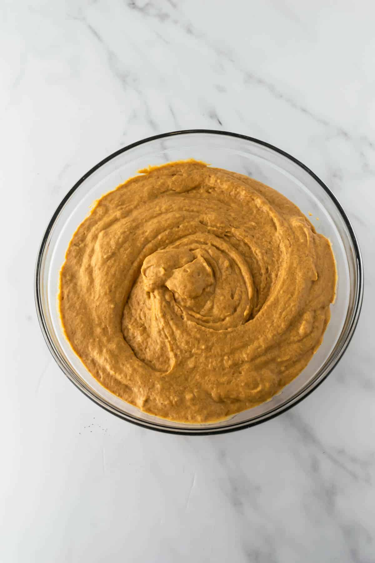 pumpkin pancake batter in a glass bowl.