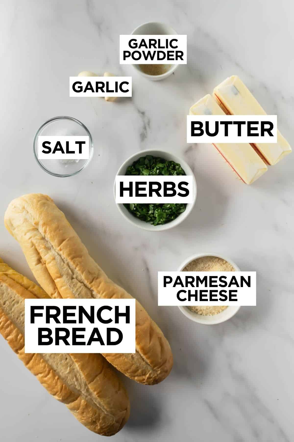 ingredients for homemade garlic bread on a white table with overlay text.