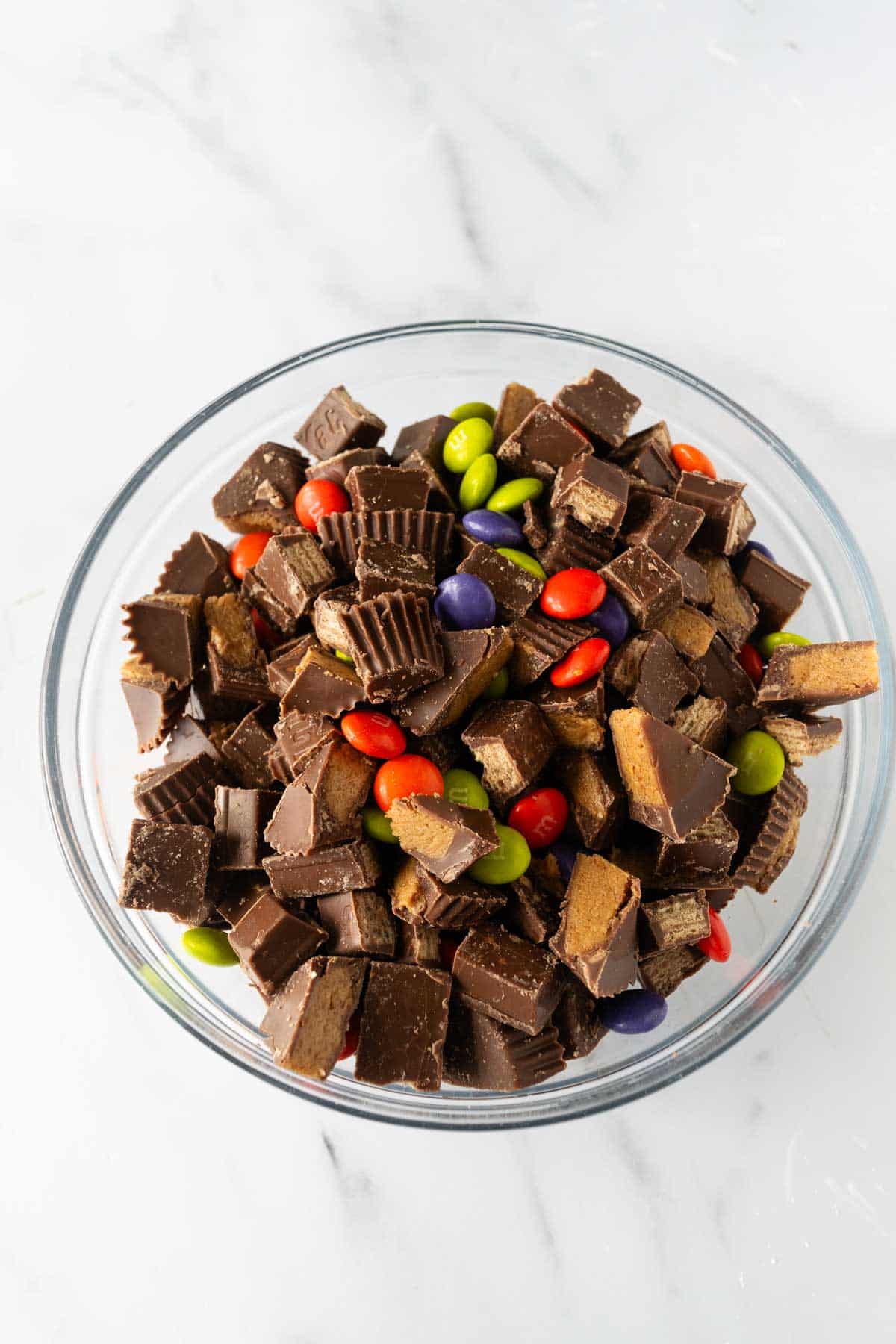 chopped Halloween candy in a glass bowl.