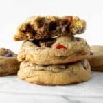 three stacked Halloween candy cookies on a white table.