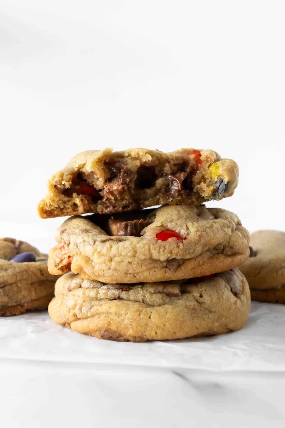 stacked Halloween candy cookies on a white table.