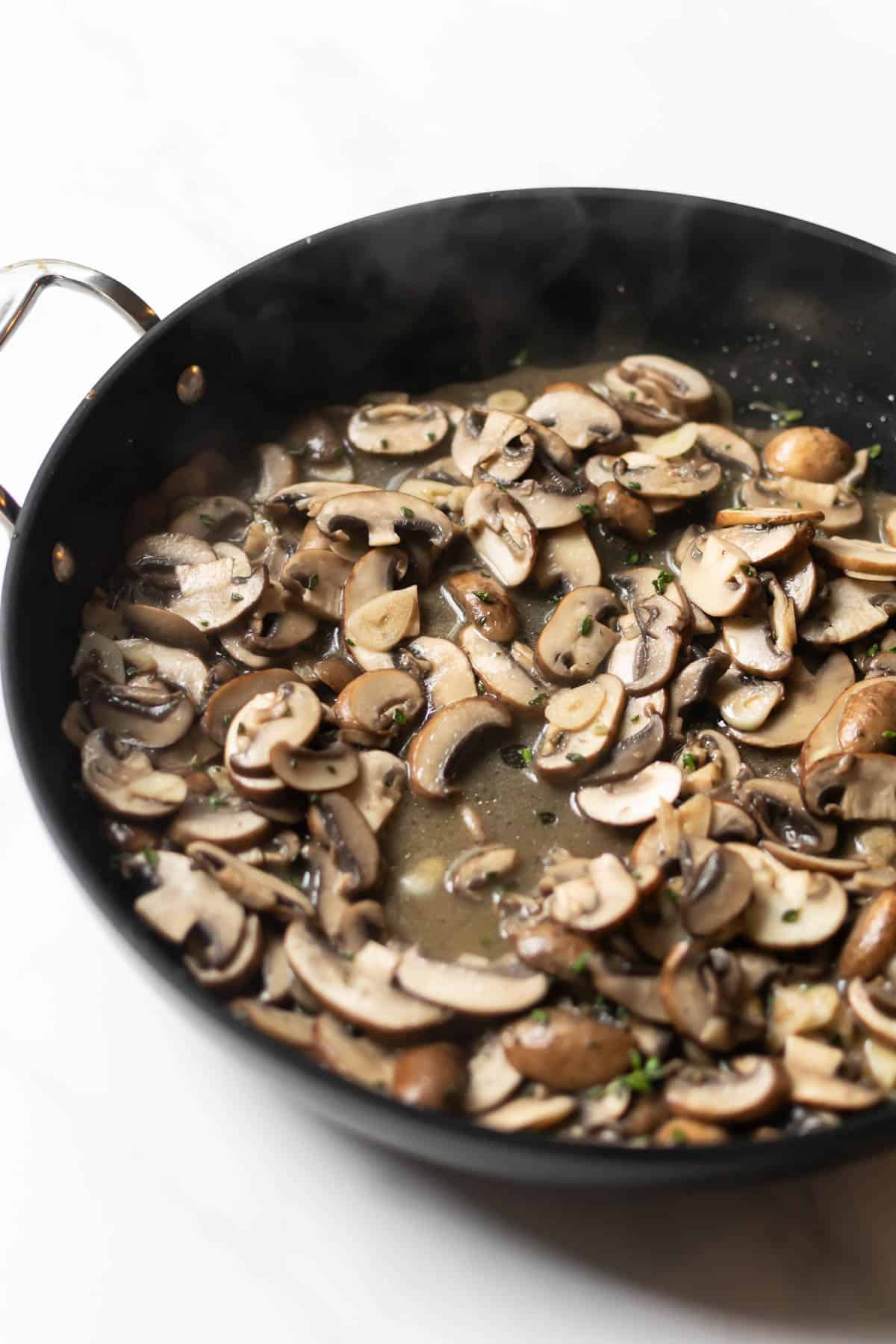 mushrooms in a black skillet.